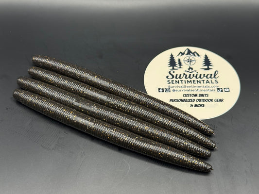 Black and Gold — Black and Gold 5 inch stick worm soft plastic bass bait by Survival Sentimentals